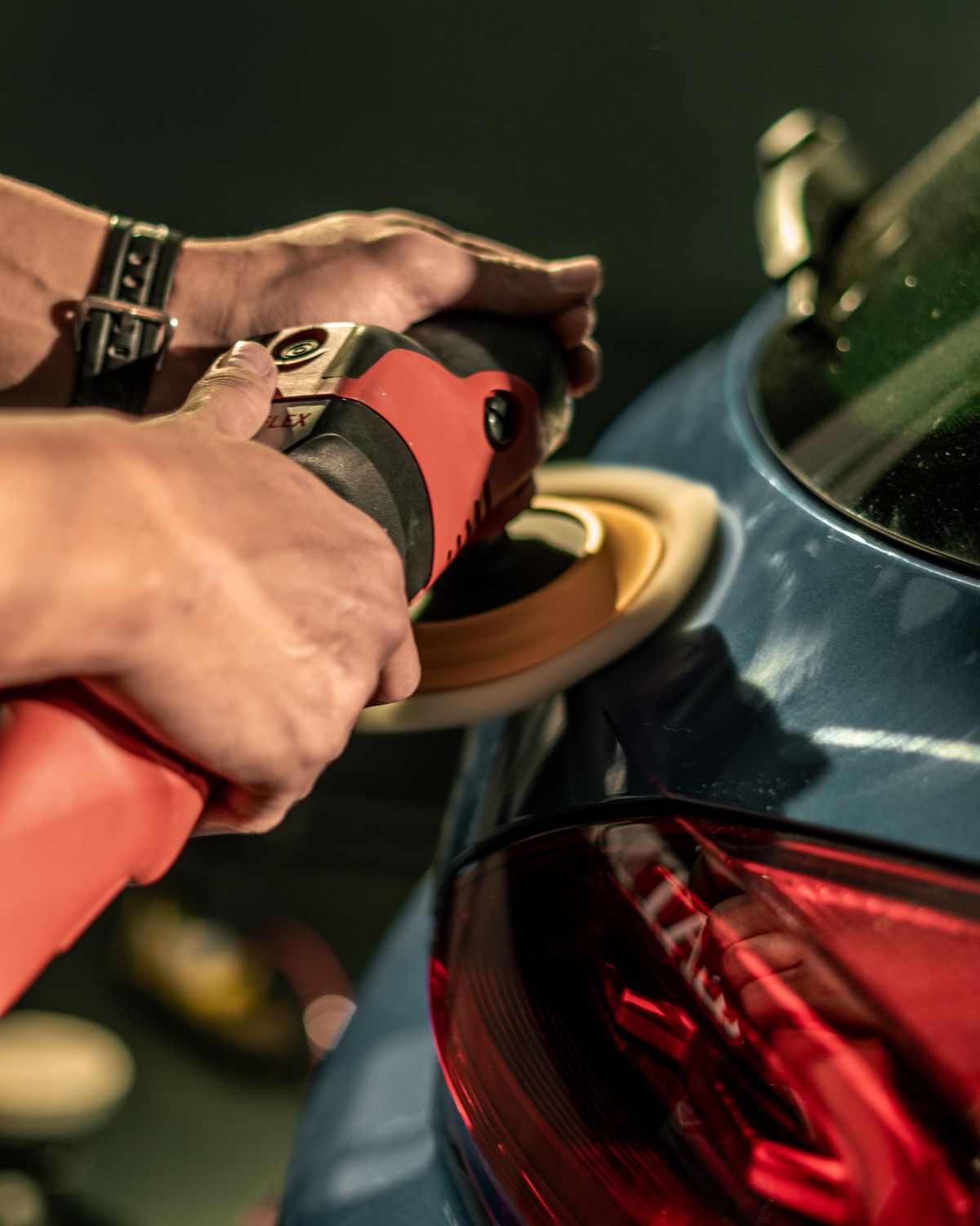 Machine buffing a car to restore gloss